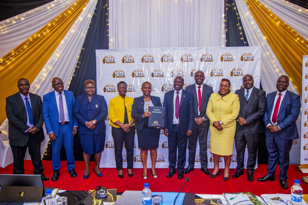 Outgoing chairman CPA Philip Kakai and other council members posing for a photo with the 26th Chairman of ICPAK CPA Prof. Elizabeth Kalunda