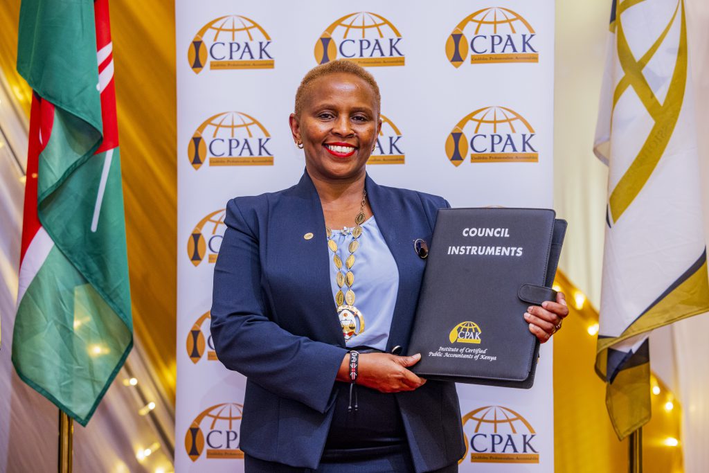 26th ICPAK Chairman CPA Prof. Elizabeth Kalunda posing with the Council Instruments during the 47th AGM